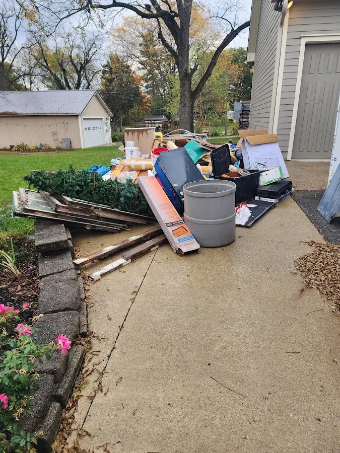 Dumpster being loaded with debris for 3 Yard Dumpster Rental in Stillwater